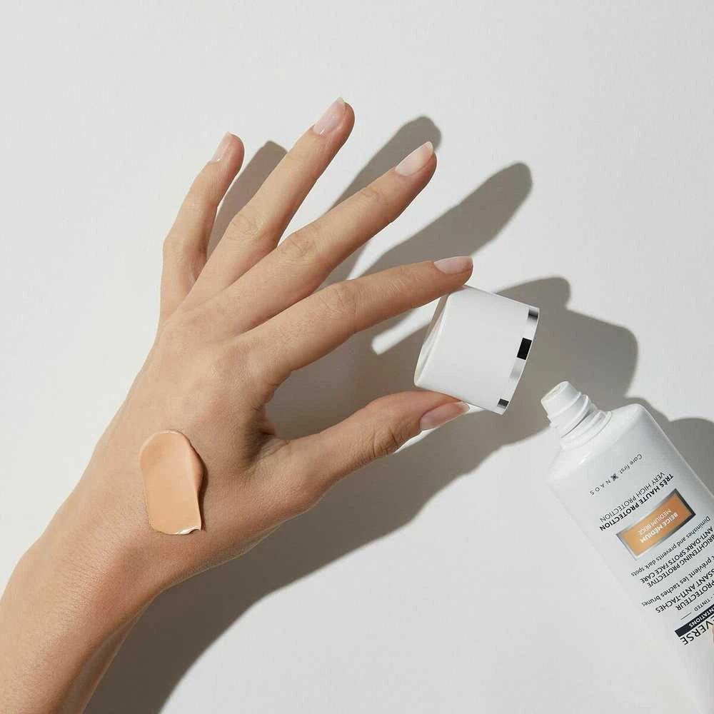 Institut Esthederm Institut Estherderm Photo Reverse rusvai gelsvas Medium apsauginis kremas nuo tamsių dėmių didelė apsauga nuo saulės 50ml
