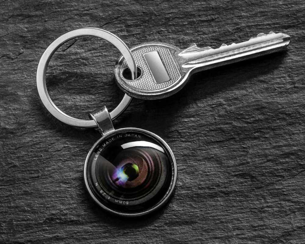 Raktų pakabukas fotoaparato objektyvui