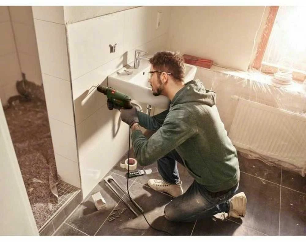 Bosch smūginis grąžtas - Easyimppact 600 (tiekiamas dėžutėje su 1 papildoma rankena ir 1 gylio atrama)
