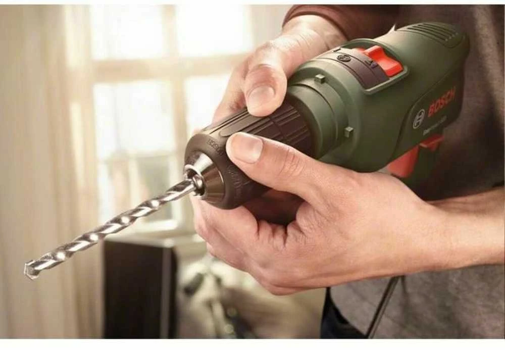 Bosch smūginis grąžtas - Easyimppact 600 (tiekiamas dėžutėje su 1 papildoma rankena ir 1 gylio atrama)