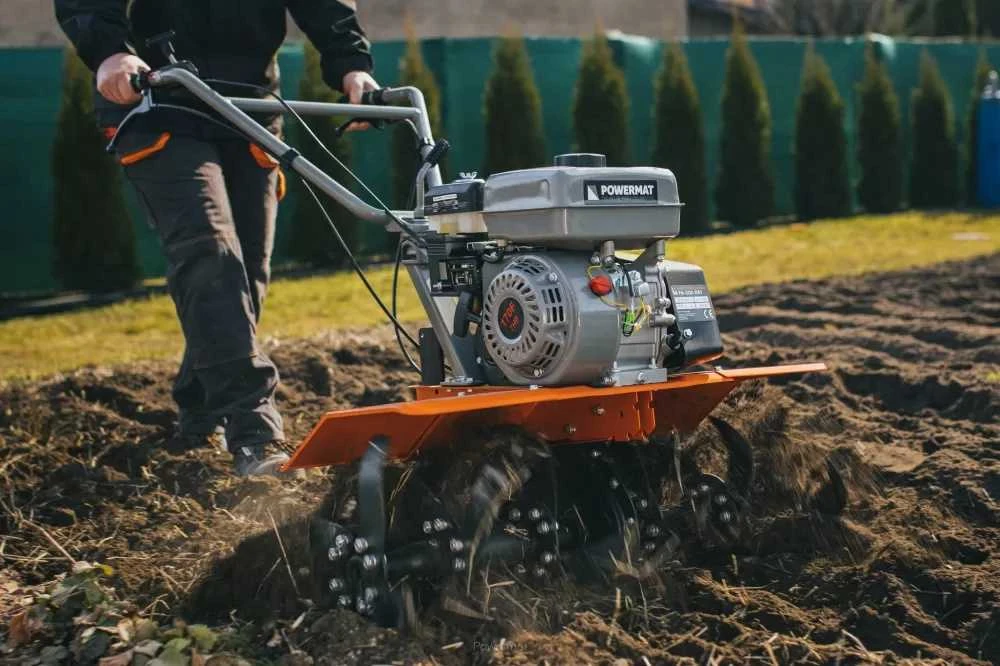 Benzininis kultivatorius, sodo dirvos apdirbimui, su reguliuojamu darbiniu pločiu, galingas 7AG variklis, tvirtas dirvos paruošimas