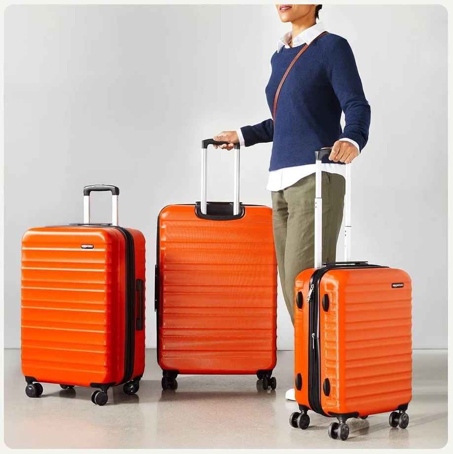 Kelioninis Amazon Basics kietų lagaminų rinkinys, 3 vnt., ABS korpusas, 55 cm, 68 cm, 78 cm, oranžinis