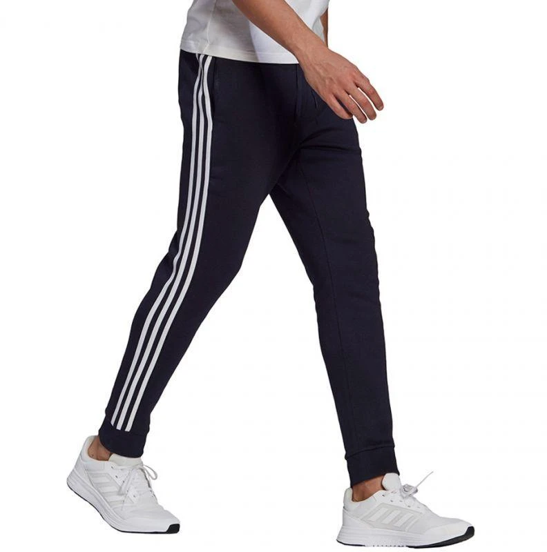 Adidas Essentials Flisinės kelnės su 3 juostomis ir siaurėjančiais galais M GK8823