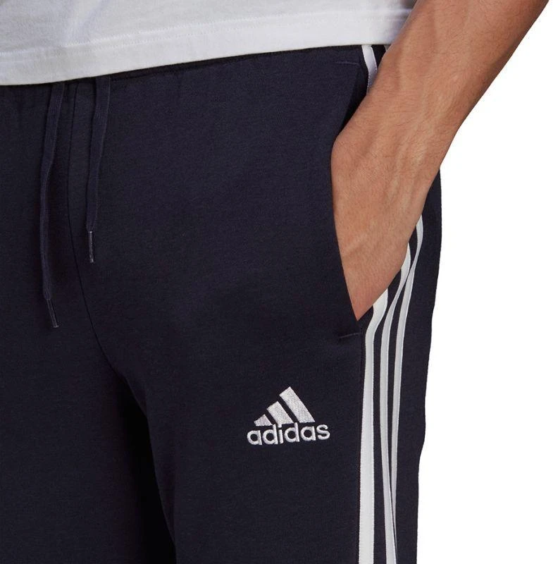 Adidas Essentials Flisinės kelnės su 3 juostomis ir siaurėjančiais galais M GK8823