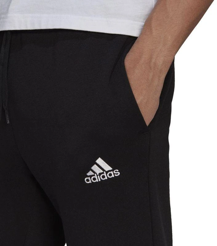 Adidas Essentials siaurėjančios kelnės su rankogaliais M GK9222