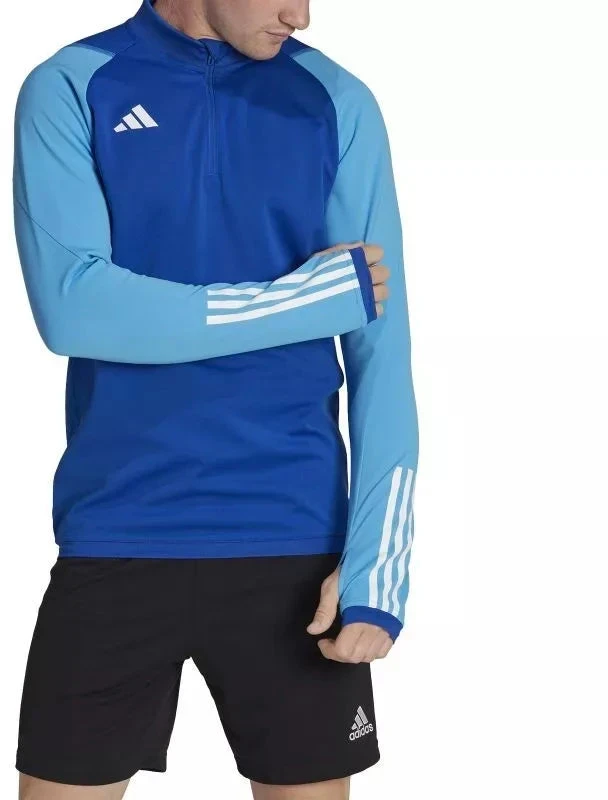 Adidas Tiro 23 Competition Training Top M HU1309 |” Pasiruoškite varžyboms su „Adidas Tiro 23 Competition“ treniruočių viršutine dalimi. Sukurta atlikti treniruočių metu, ši viršutinė dalis pasižymi drėgmę sugeriančia „AEROREADY“ technologija, kur