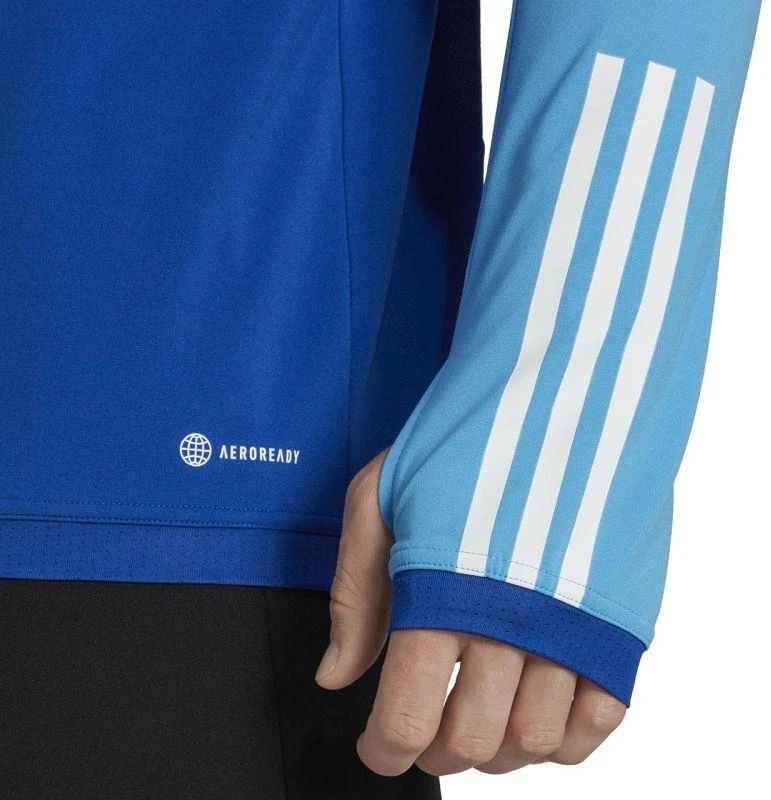 Adidas Tiro 23 Competition Training Top M HU1309 |” Pasiruoškite varžyboms su „Adidas Tiro 23 Competition“ treniruočių viršutine dalimi. Sukurta atlikti treniruočių metu, ši viršutinė dalis pasižymi drėgmę sugeriančia „AEROREADY“ technologija, kur