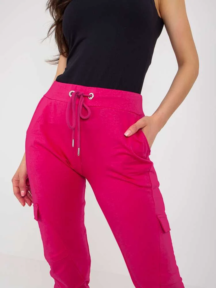 Fuksijų spalvos sportinės kelnės