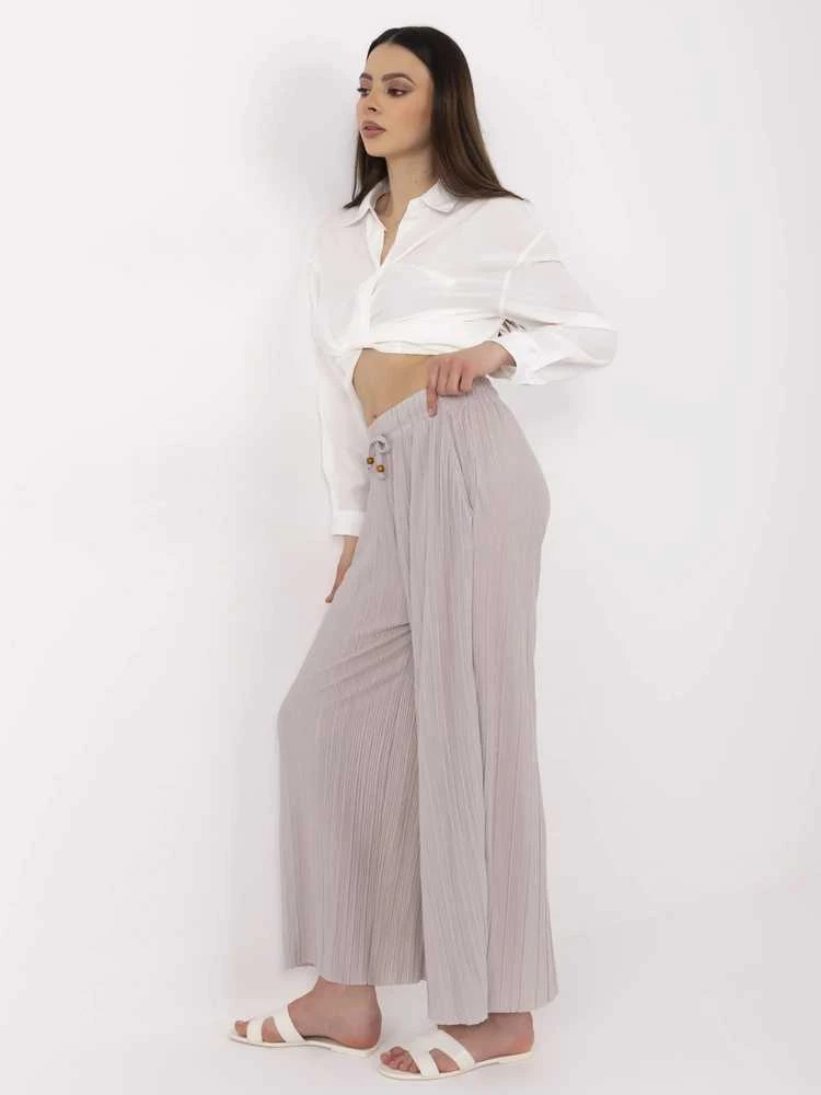 Kelnės moterims smėlio spalvos elegantiškos
