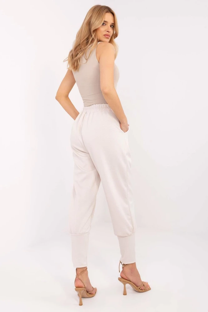 Moteriškos kelnės su kišenėmis ir juosmens raišteliu Italy Moda