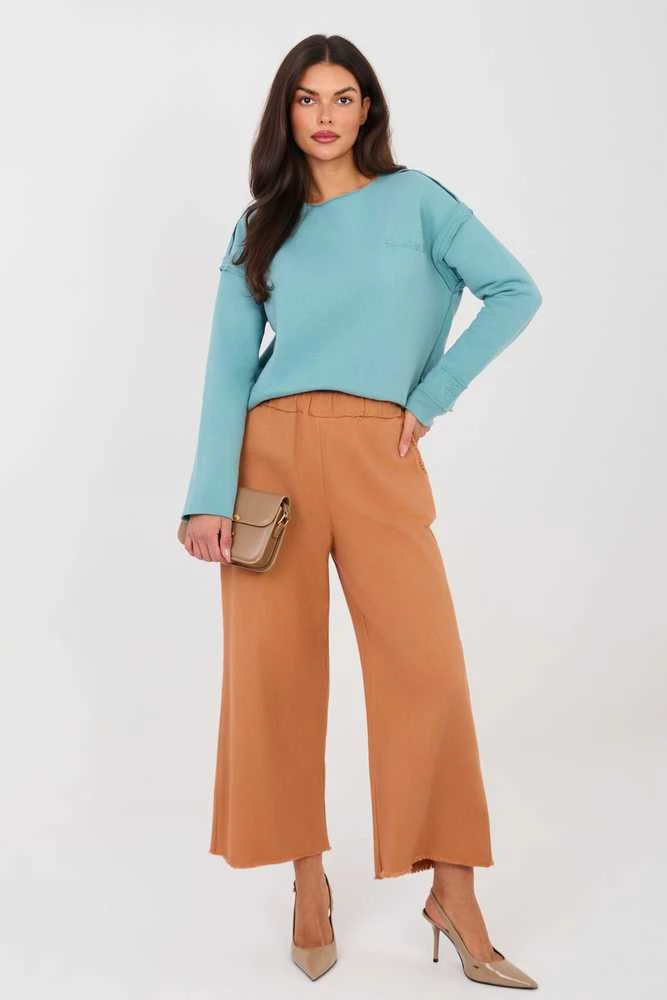 Moteriškos platėjančios džinsinės kelnės tamsiai oranžinės spalvos