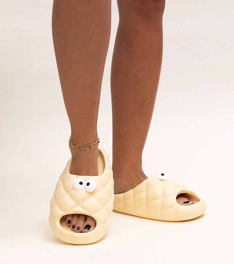 Smėlio spalvos Crocs“ tipo šlepetės su Gorgonės akimis