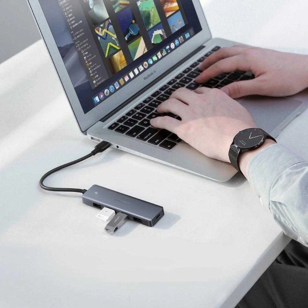 4-in-1 adapteris UGREEN USB Hub prie 4x USB 3.0 + USB-C (pilka)