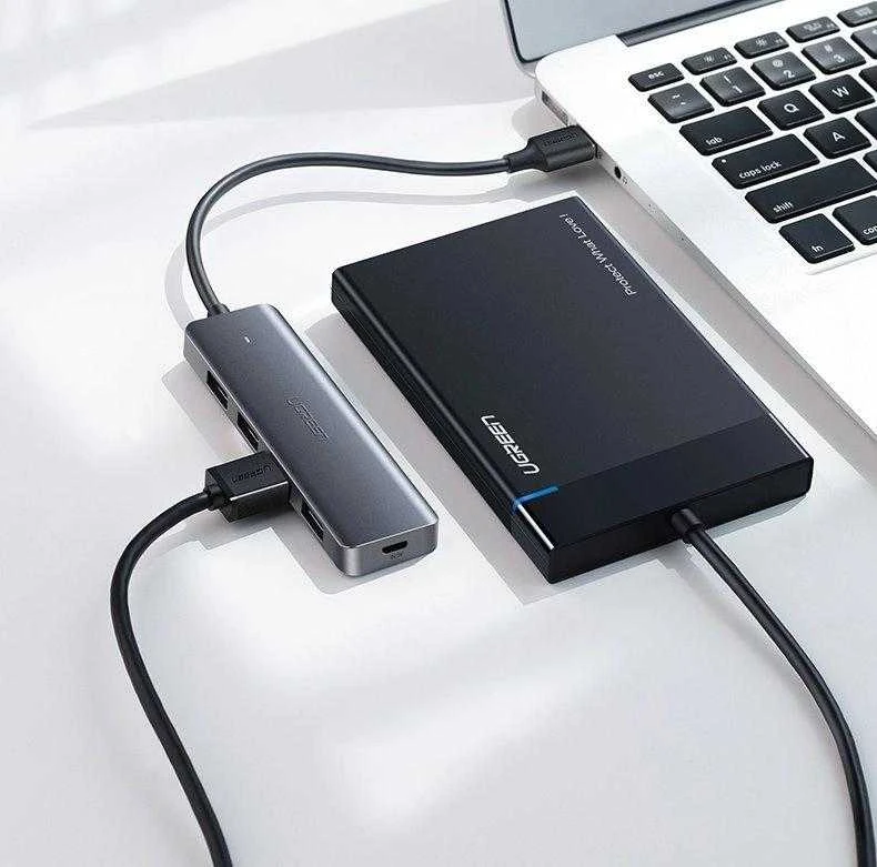 4-in-1 adapteris UGREEN USB Hub prie 4x USB 3.0 + USB-C (pilka)