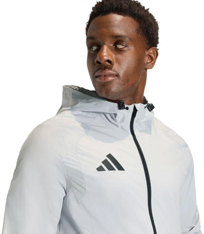 Vyriška adidas Tiro 26 kelioninė striukė nuo vėjo, šviesiai pilka KD3336