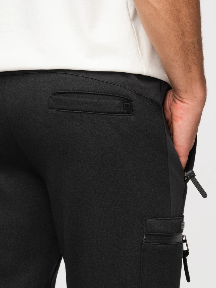 Vyriški juodi jogger tipo laisvalaikio džemperio stiliaus kelnės su kišenėmis ant šlaunų