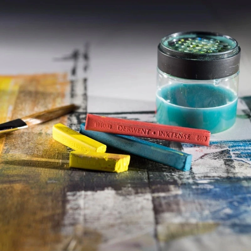 Derwent Akvarelinės kreidelės Inktense 12vnt. metalinė dėžutė