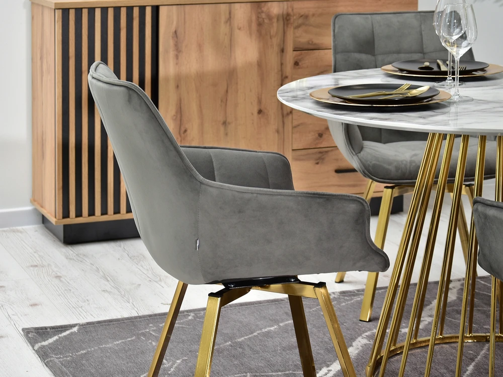 Mebel Partner ELEGANTIŠKA SUKAMOJI KĖDĖ ARUBA VALGOMO KAMBARIAI PILKAS AKSOMINIS AUKSO PAGRINDAS