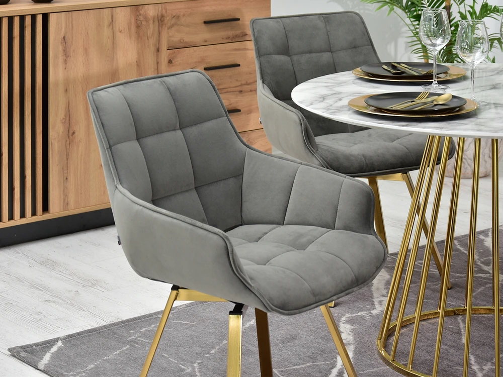 Mebel Partner ELEGANTIŠKA SUKAMOJI KĖDĖ ARUBA VALGOMO KAMBARIAI PILKAS AKSOMINIS AUKSO PAGRINDAS