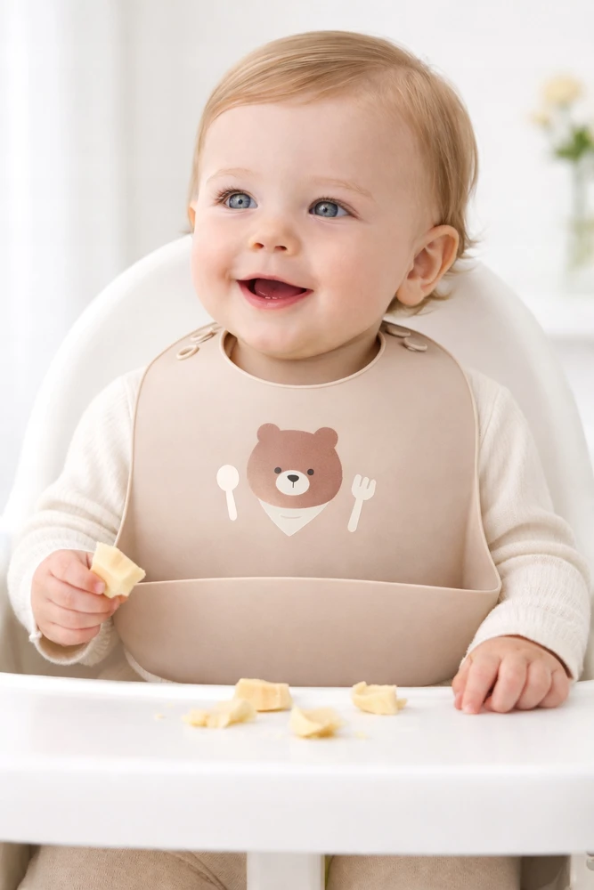 Milababy Lankstus silikoninis seilinukas su puodeliu ir kišene, minkštas ir atsparus vandeniui
