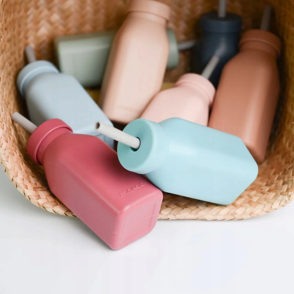 Minikoioi SILIKONINIS BUTELINIS PUODULIS VAIKAMS SU ŠIAUDU IR DANGIU 200 ML 6M+ ROŽINĖS