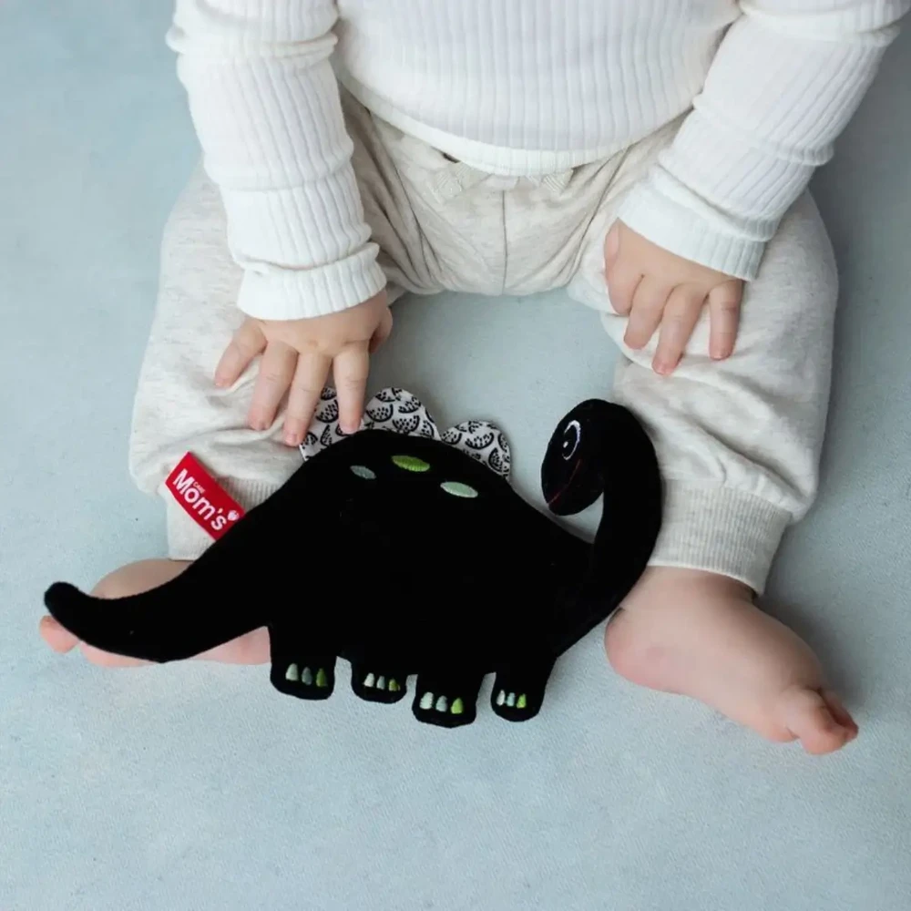 Mom's Care HENCZ 123 Dinozaurų ošiantis kontrastinis audinys