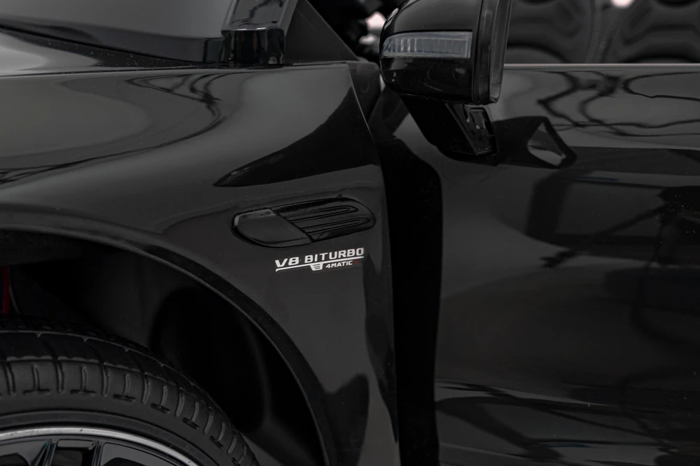 Vaikiškas elektrinis Mercedes Benz AMG SL63 su LED šviesomis ir muzikos funkcija