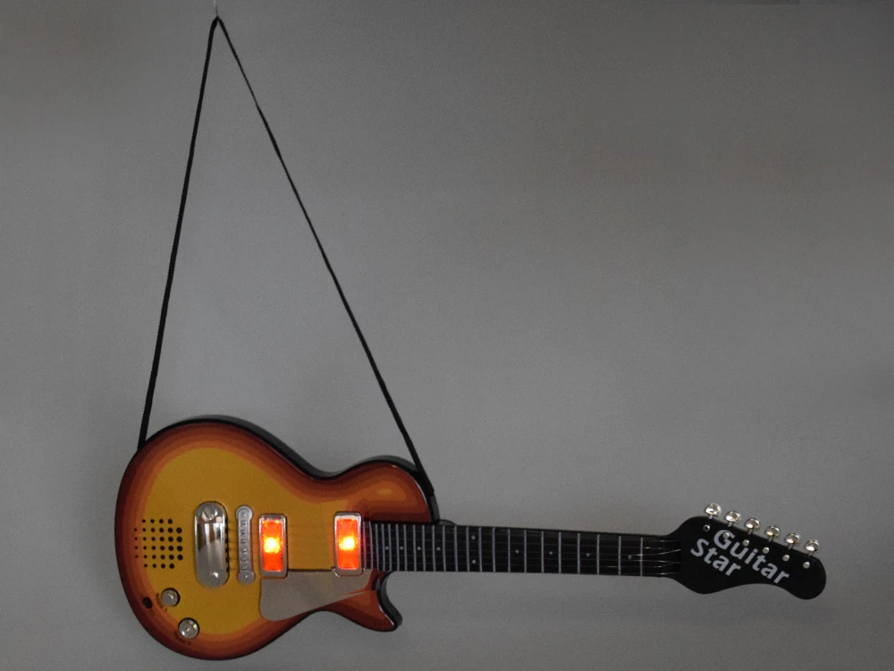 Jokomisiada Elektrinės gitaros žaislas vaikams melodijos, šviesa + dirželis IN0169 CI