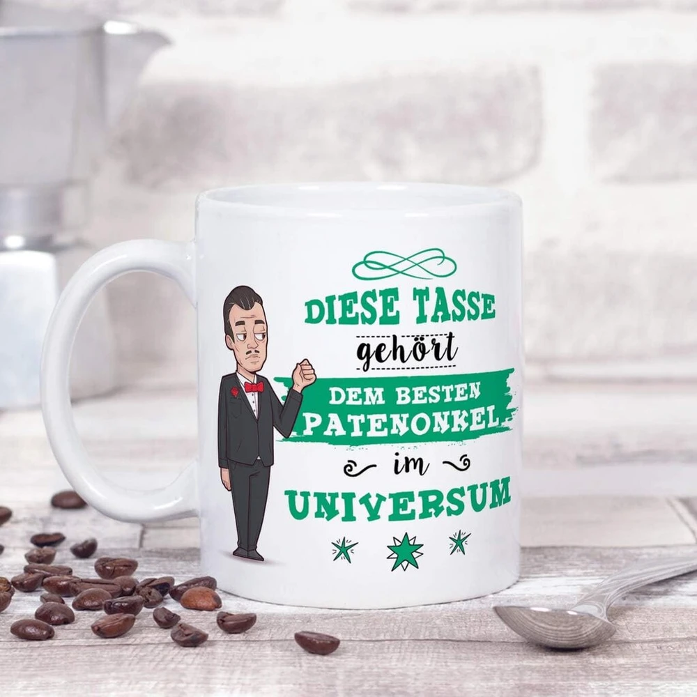 Mugffins puodelis krikštatėviui su vokišku tekstu "bester Patenonkel im Universe" (geriausias krikštatėvis visatoje). Gražus ir juokingas kavos puodelis kaip dovana krikštatėviui, keraminis, 350 ml