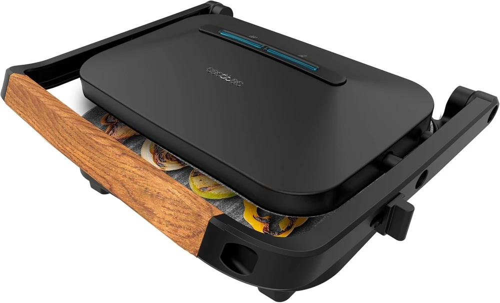 Gertuvė Cecotec Rock'ngrill 1300 Wood B. 1300 W galia, juodas dizainas, rockstone danga, neslystantis pagrindas, plaukiojanti plokštė, šviesos indikatorius, medinė rankena, universalumas