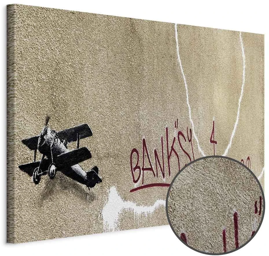 Paveikslas Lėktuvas su raudonu grafičio tekstu (Banksy)