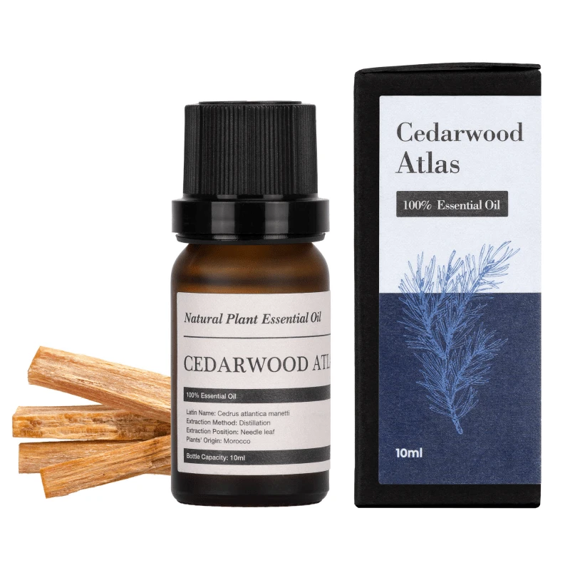 Cedarwood Atlas eterinis aliejus su pakuote ir medžio šakelėmis