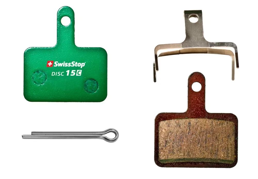 SWISSSTOP diskinių stabdžių kaladėlės, 15 C, Shimano Deore, Kevlaro keramika, žalvaris, derva, kompozitas, plienas, 1 komplektas (2 kaladėlės)