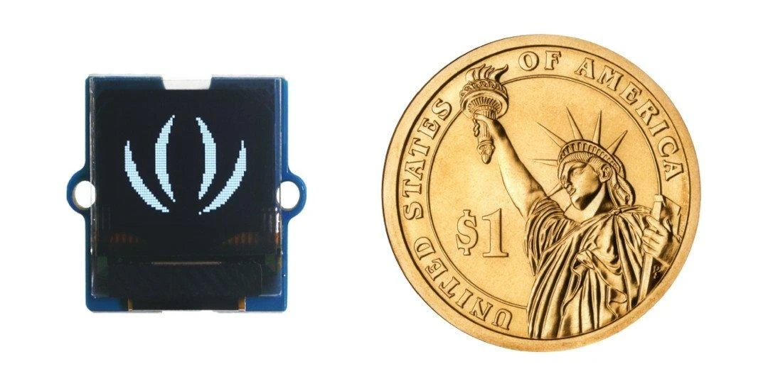 Grove 0.66“ OLED ekranas šalia vieno dolerio monetos