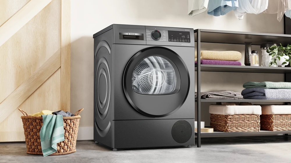 „Bosch“ džiovyklė su šilumos siurbliu | WQG245DXSN | Energijos vartojimo efektyvumo klasė C | Priekinis pakraunamas | 9kg | Kondensacija | LCD | Gylis 61,3 cm | Pilkas