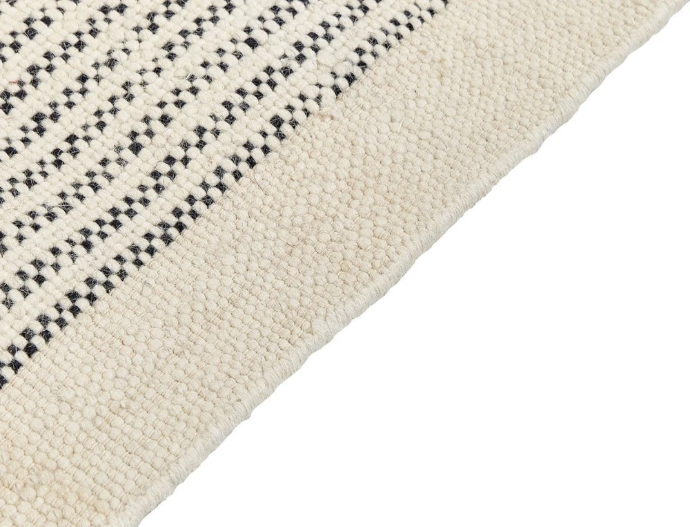 Beliani Kilimas DIVARLI smėlio spalvos 80 x 150 cm vilnonis