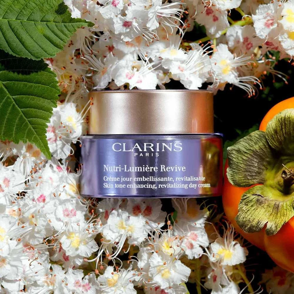 Clarins Nutri-Lumiére Revive Skin Tone Enhancing, Revitalizing Day Kreminis Day Kreminis moterims, 50 ml