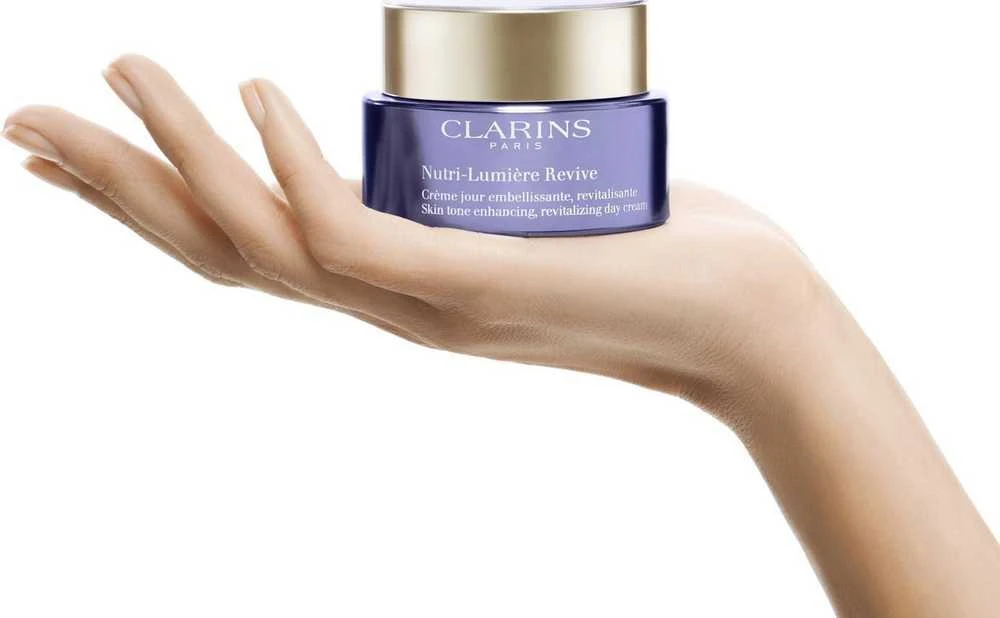Clarins Nutri-Lumiére Revive Skin Tone Enhancing, Revitalizing Day Kreminis Day Kreminis moterims, 50 ml