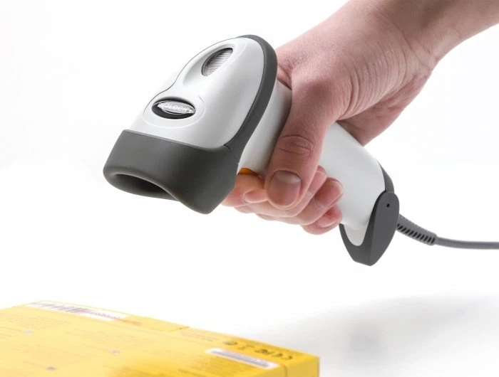 Skeneris Delock USB Barcode Scanner 1D su kablem połączeniowym i laikikliu - lazerinis - šviesiai pilkas