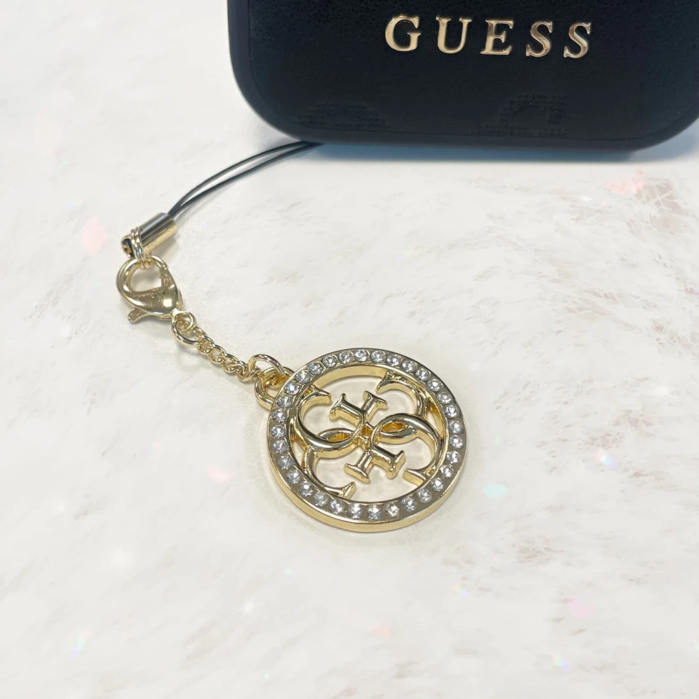 Dėklas Guess pakabukas GUCPM4DRD telefono dirželis 4G Rhinestone Charm