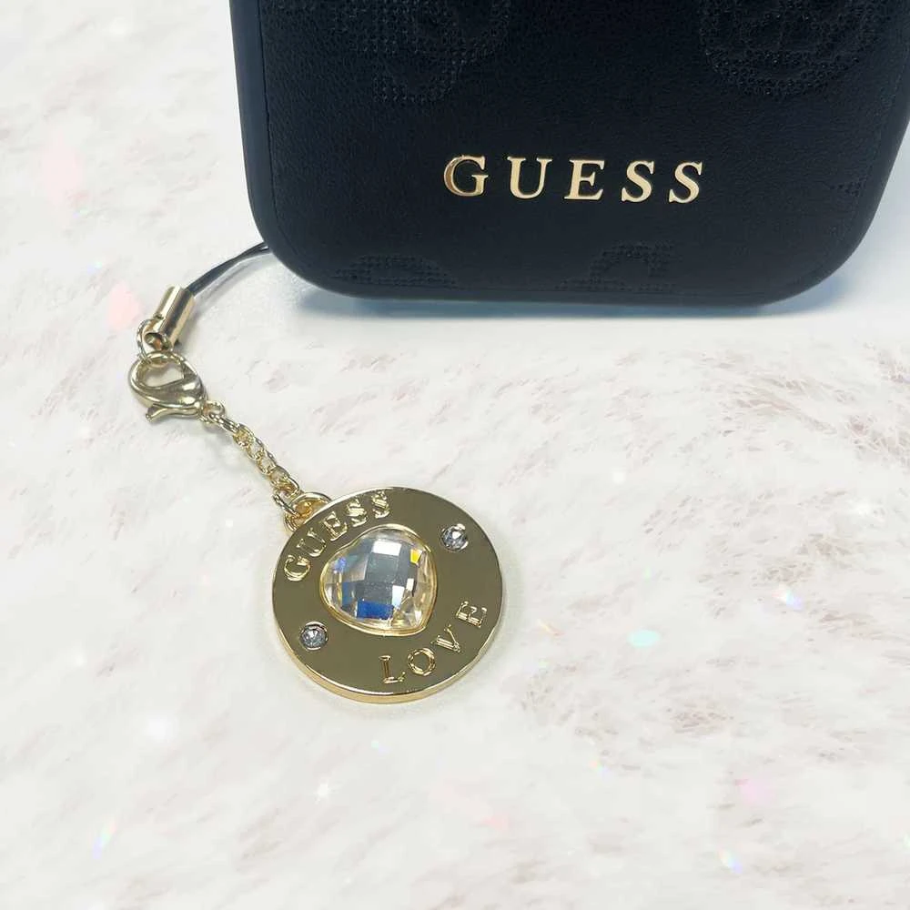 Guess GUCPMHGLD virvelė telefonui Heart Diamond Charm with Rhinestones