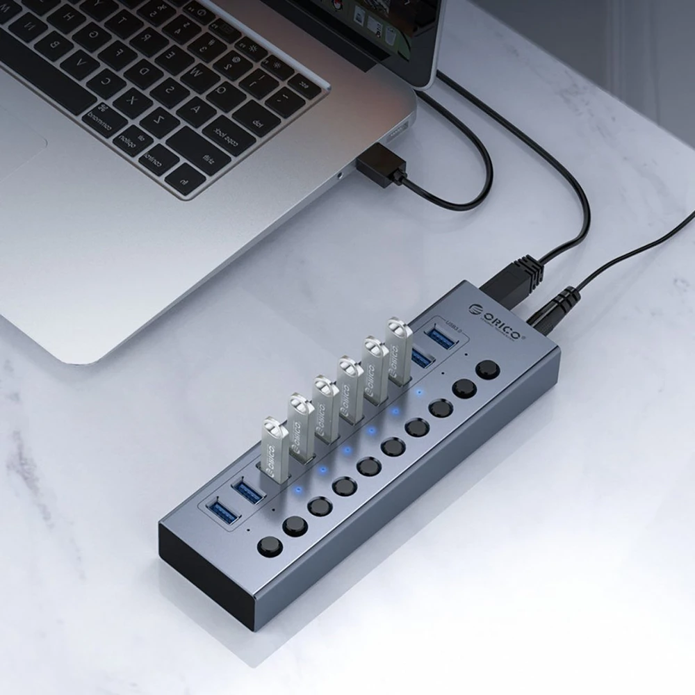 „Orico BT2U3-10AB“ šakotuvas, 10x USB-A 3.0, su jungikliais – pilkos spalvos
