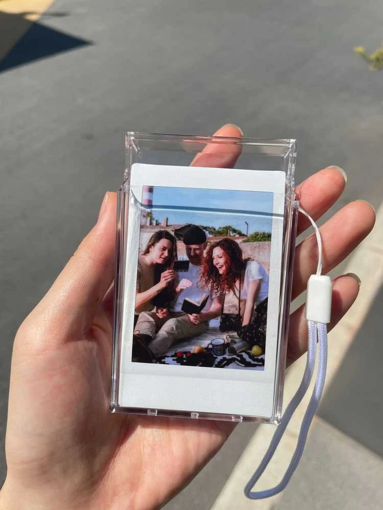 „LoveInstant“ dėklas 6 viename: dėklas + stiklas + 64 nuotraukų albumas + dangtelis + „Fuji Instax Mini Evo“ rėmeliai – skaidrus