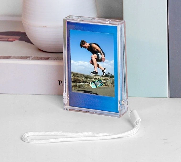 „LoveInstant“ dėklas / dėžutė + nuotraukų rėmelis „Fuji Instax Mini“, „Xiaomi“, „HP“, „Kodak Zink“ / permatomas rėmelis / mėlynas su blizgučiais / puodelis