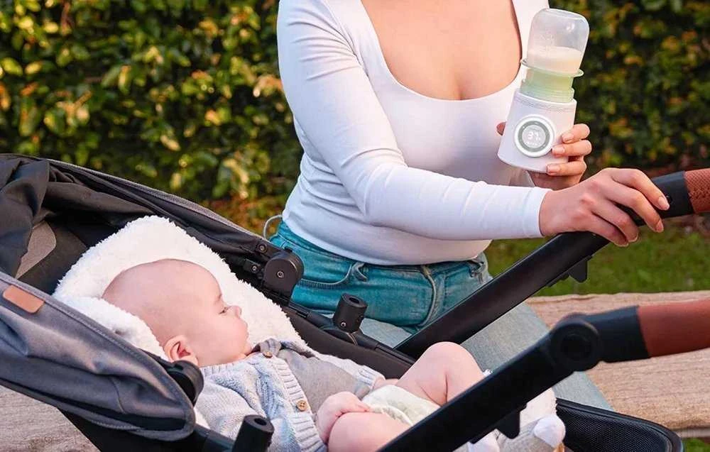 MOMCOZY ĮKRAUNAMAS KELIONINIS BUTELIUKŲ ŠILDYTUVAS