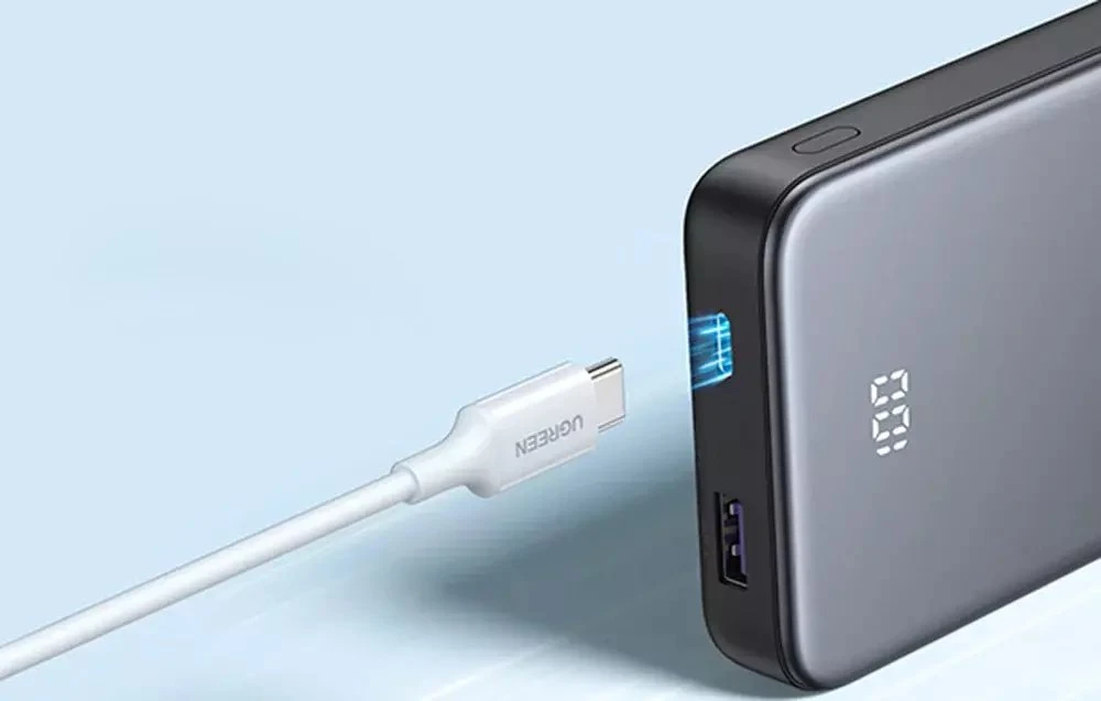 Powerbank 10000mAh Ugreen PB526 USB + USB-C, 20W, įmontuotas kabelis (pilka)