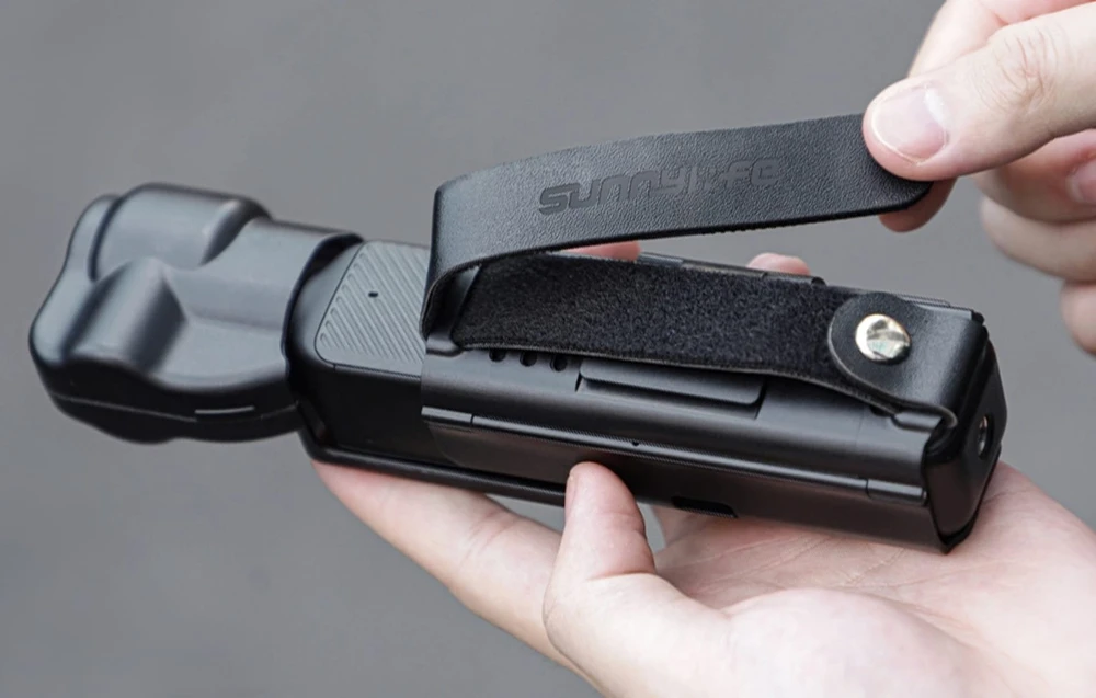 Rankinė juosta ir rankena Sunnylife, skirta DJI OSMO Pocket 3