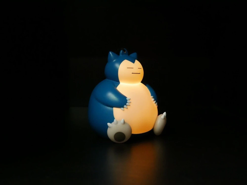 TEKNOFUN TF POKEMON ŠVIEČIANTI FIGŪRĖLĖ SU RANKOS DIRŽELIU - SNORLAX 9 CM