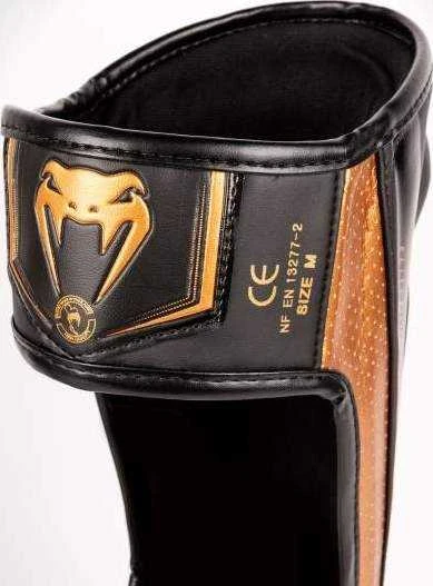 Venum Elite Evo Shinguards - Juodas/Bronze