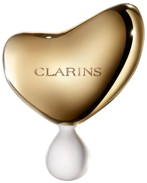 „Clarins“ brangusis auksinis veido masažo akmuo